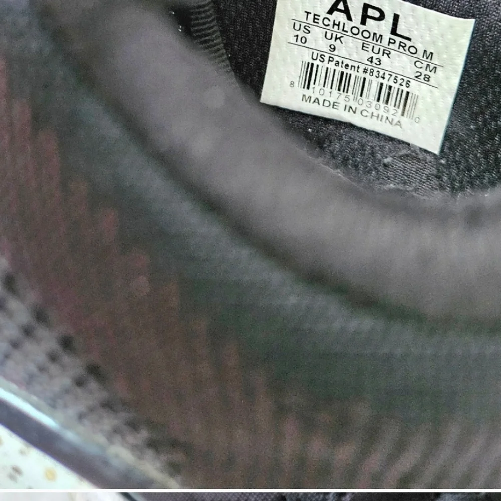APL Techloom Pro black running shoes speckled soles